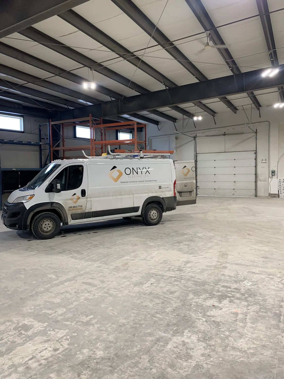 An Onyx Electric service van parked inside a clean shop bay.